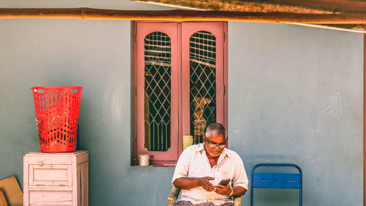 Man in white button up shirt sitting on chair near blue door.