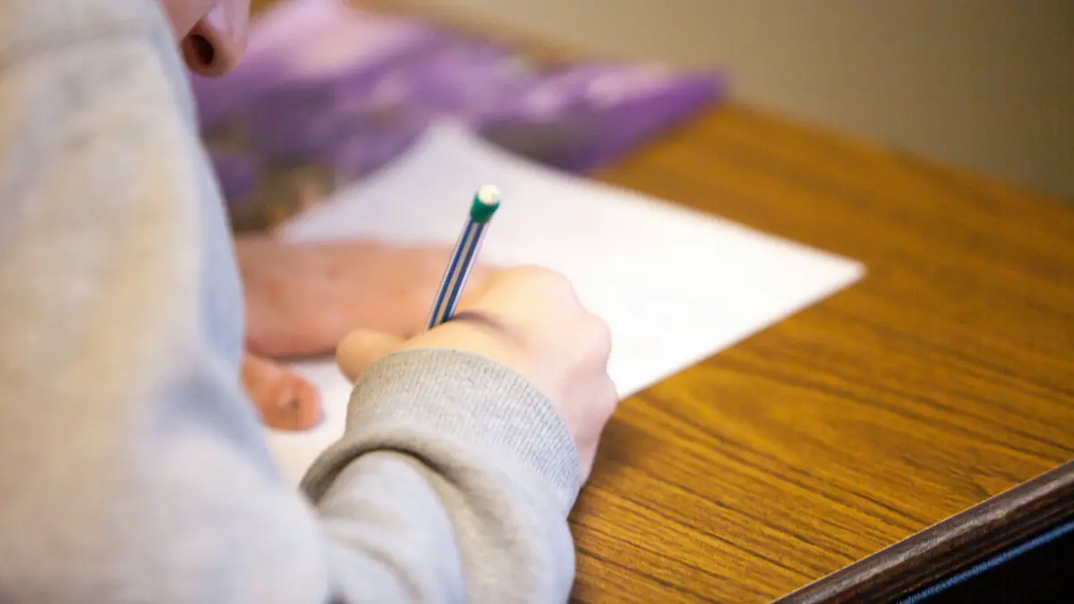Person using pencil.