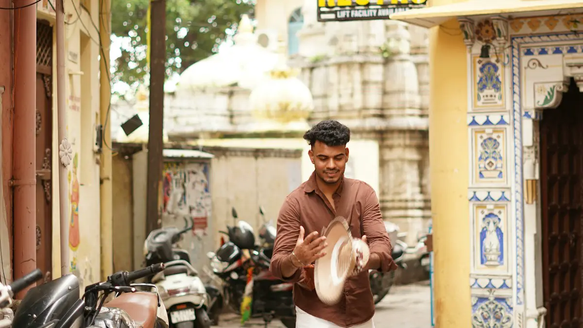 Man cleaning ballet shoes in a narrow street.