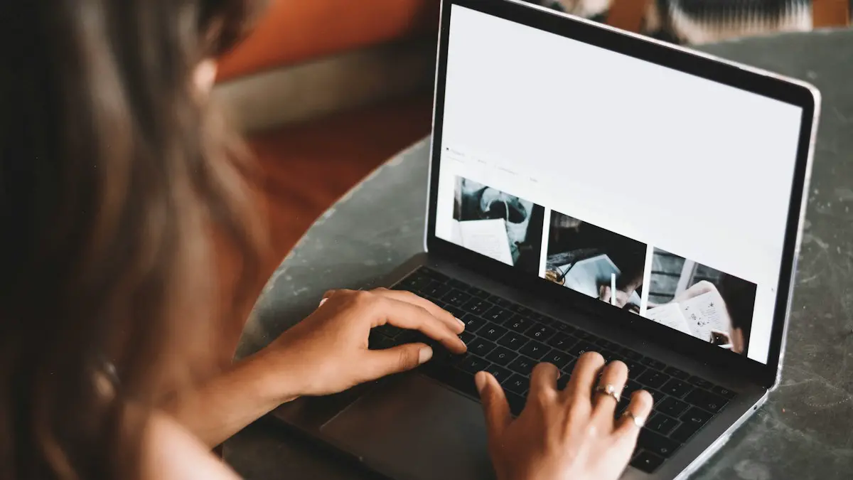 Woman using macbook pro on table.