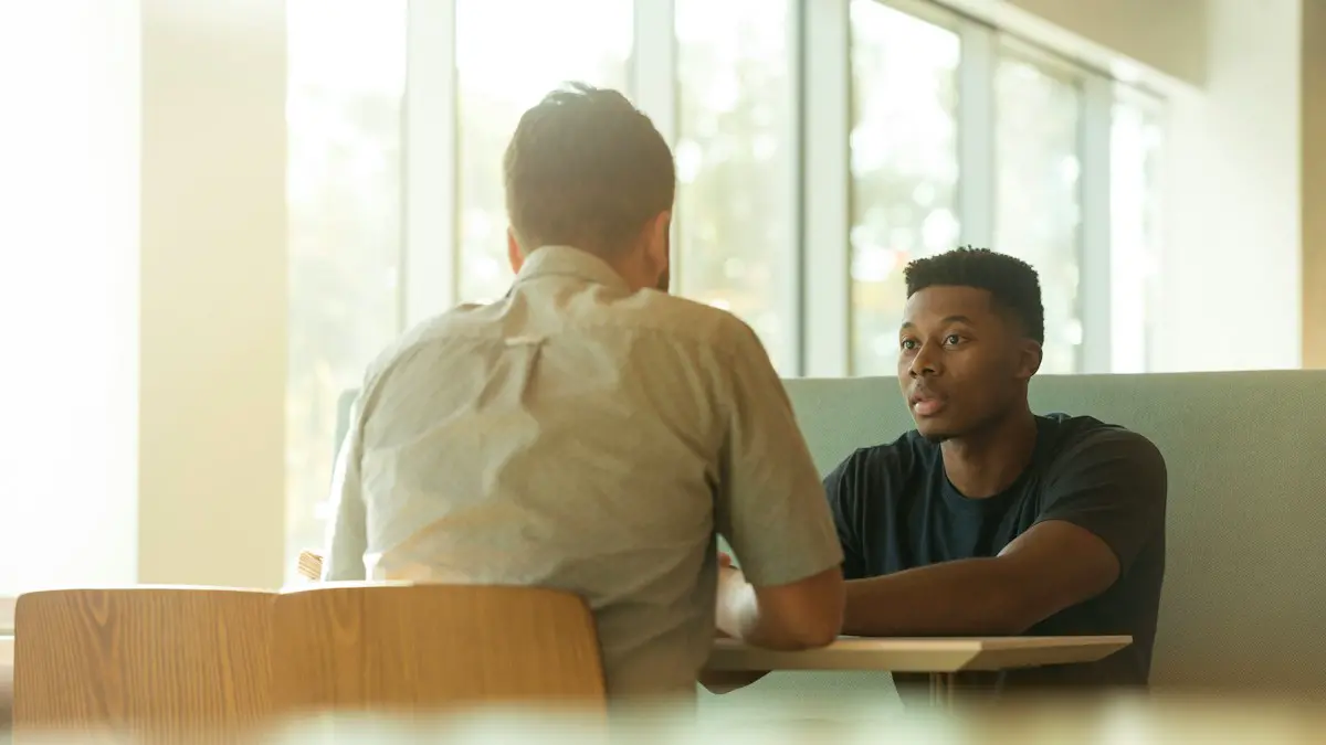 Two men talking.
