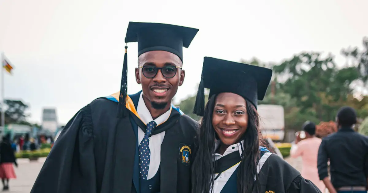 Graduates celebrating with their caps.