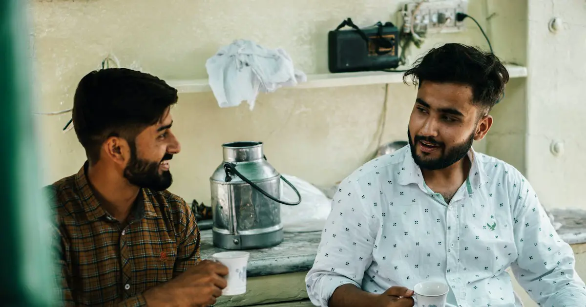 Two friends chatting over tea.