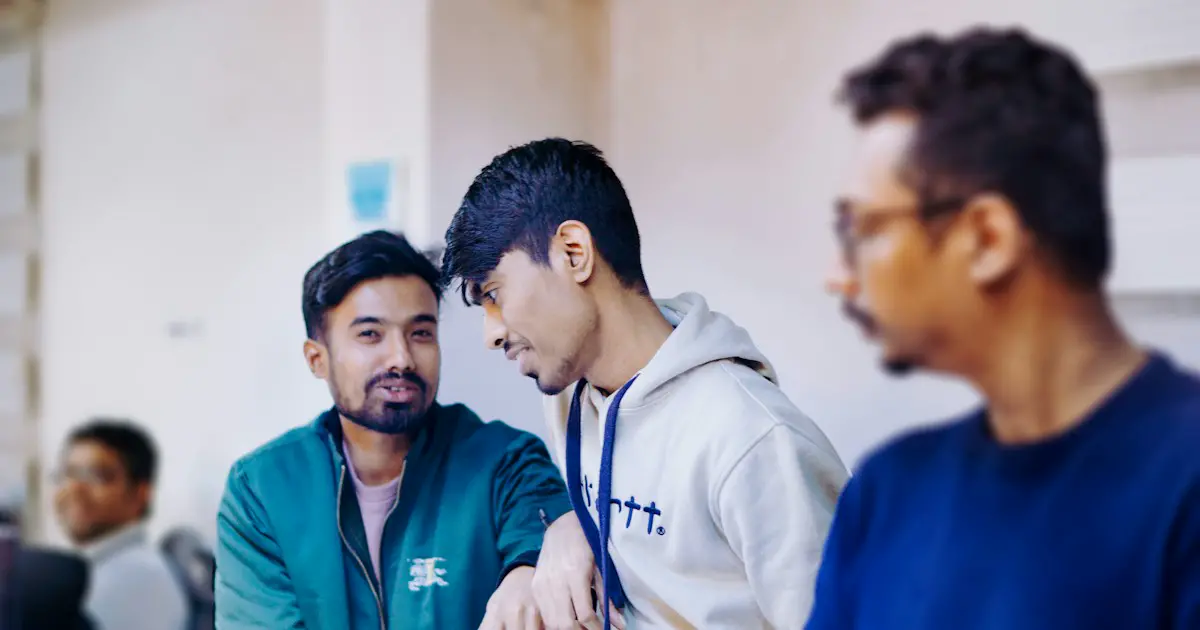Three young men deep in discussion.