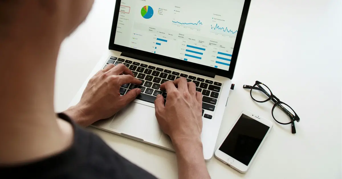 Charts and figures on a laptop screen.