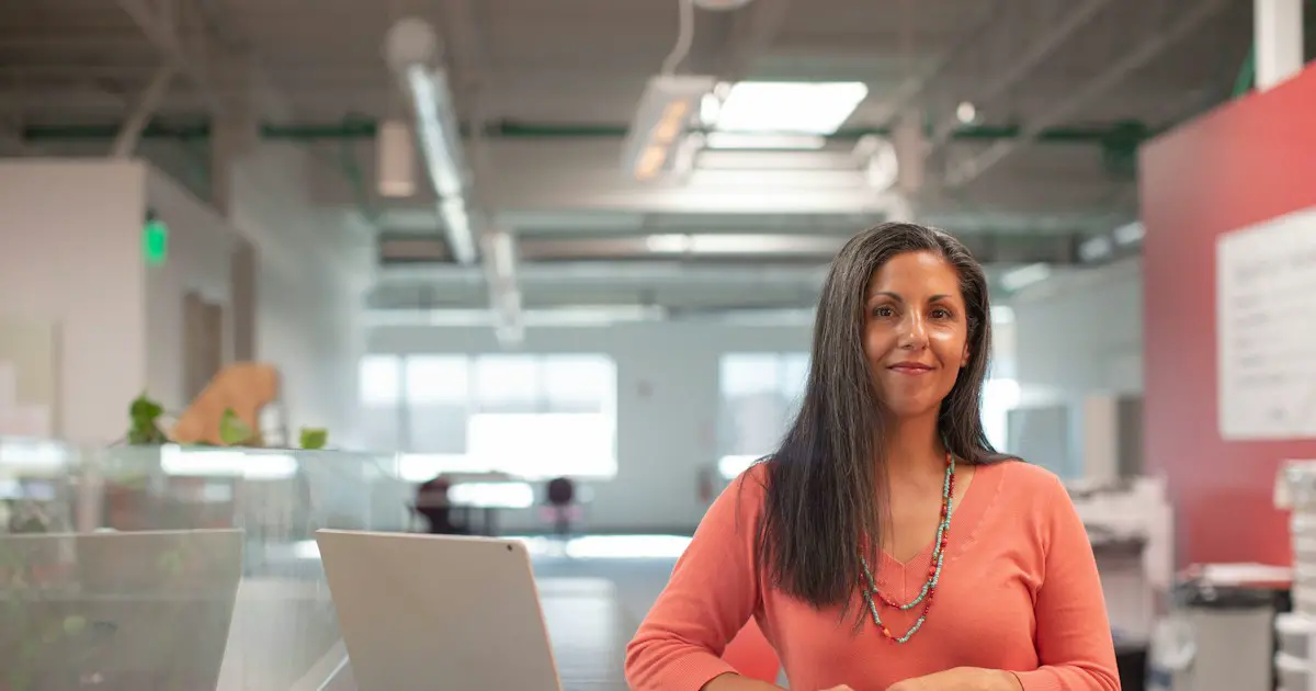 A confident young woman in an office.