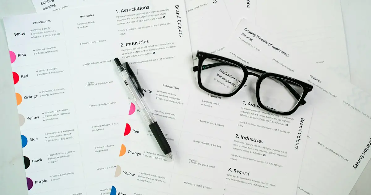 Printed documents and glasses on a desk.