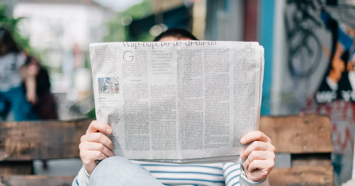 Reading the morning newspaper.