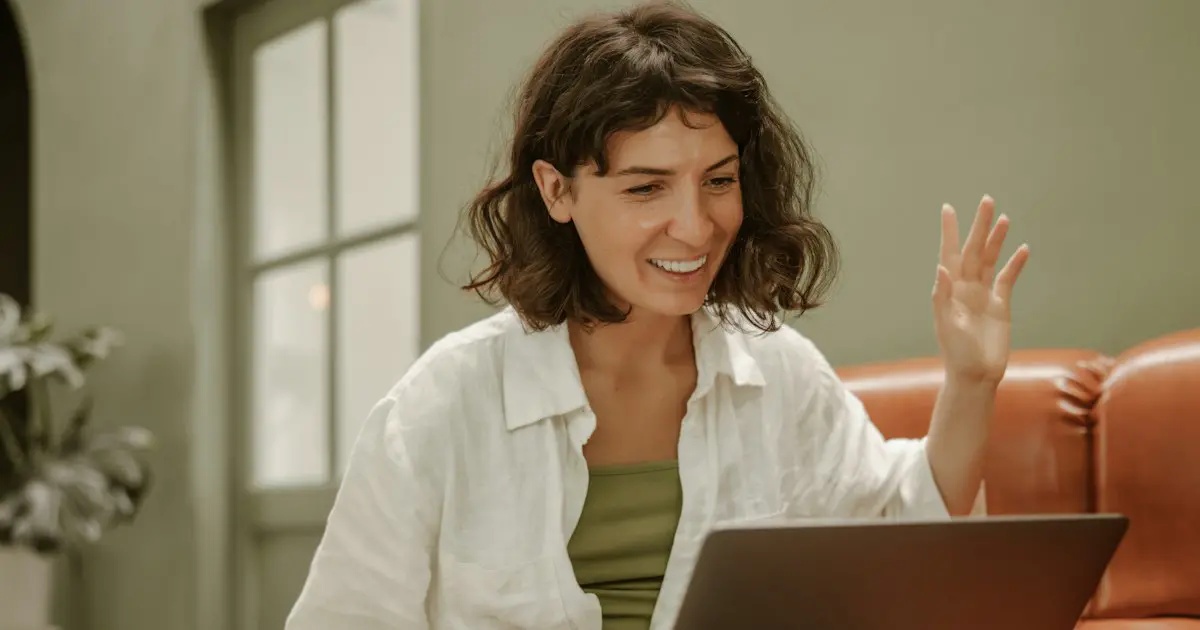 A woman explaining a point on a video call.