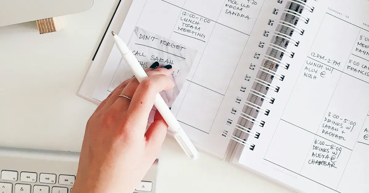 Planning the weeks ahead in a notebook.