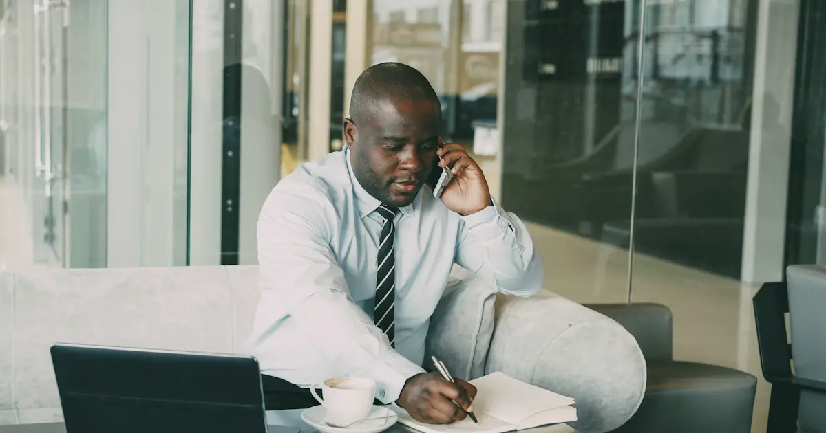 Taking notes during a phone call.