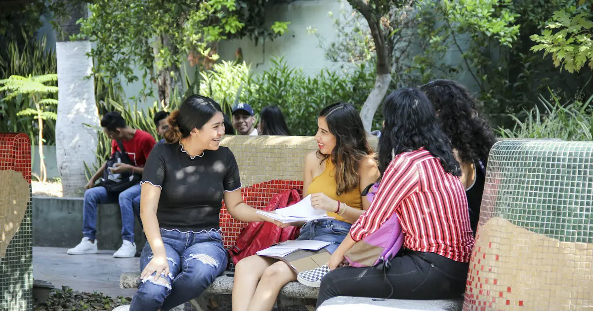 Students sitting together on a college campus.