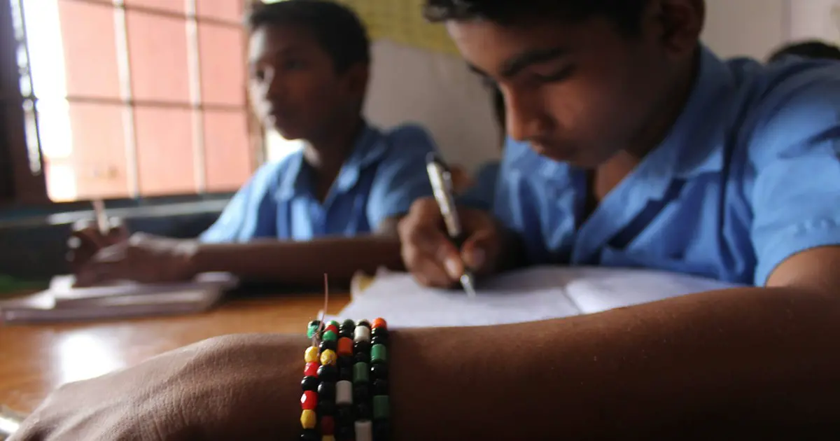 Students concentrating on a written test.
