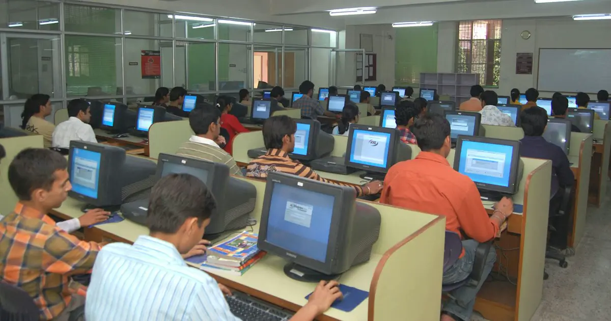 Students taking a test in a computer lab.