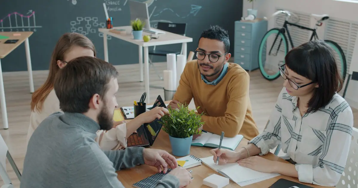 A group discussing a topic around a table.