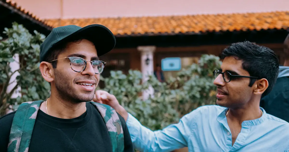 Two friends chatting and laughing.