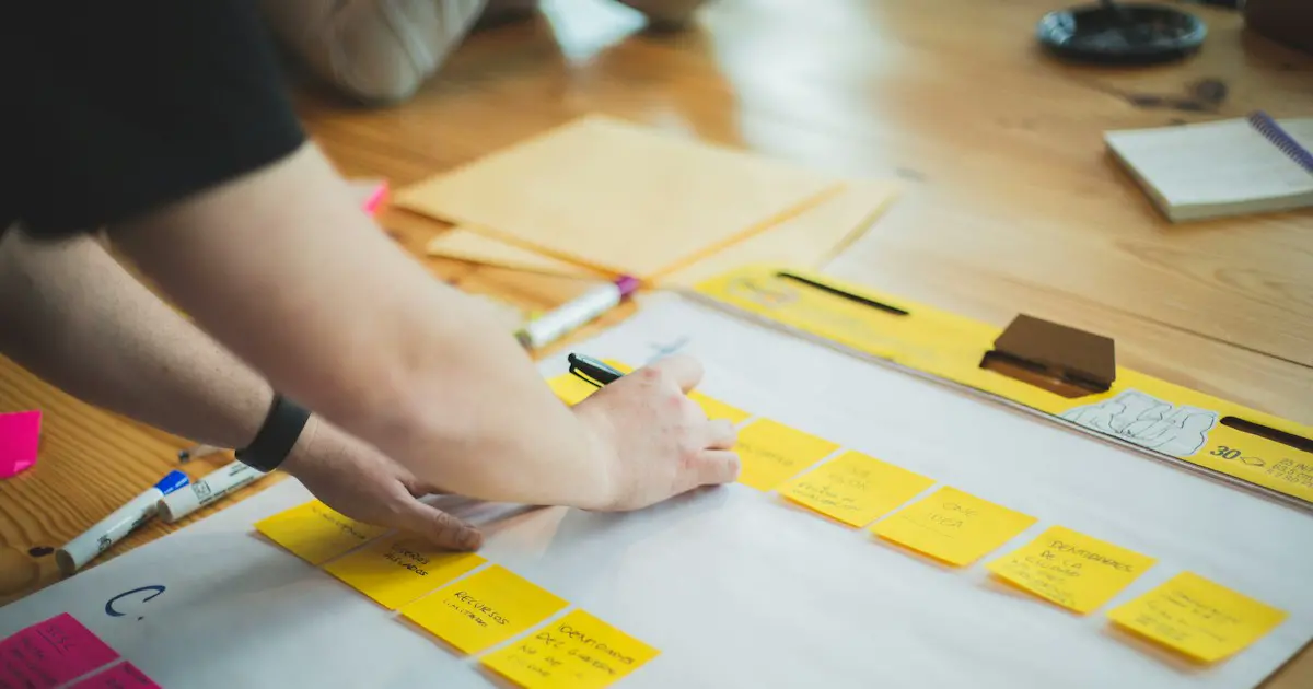 Arranging study notes on sticky notes.
