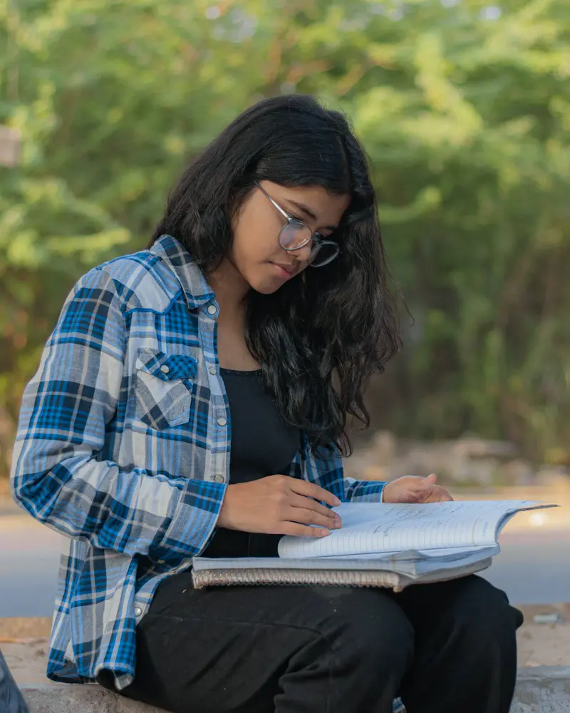 An exam aspirant studying at her desk.