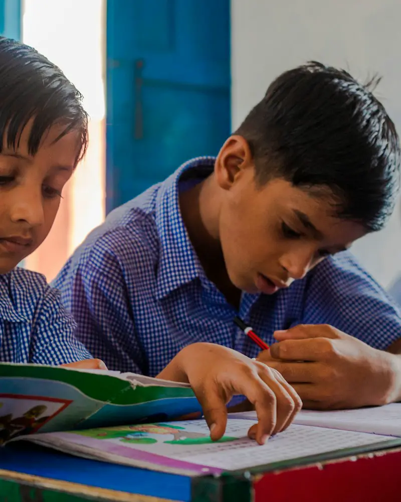 A school student revising with flashcards.