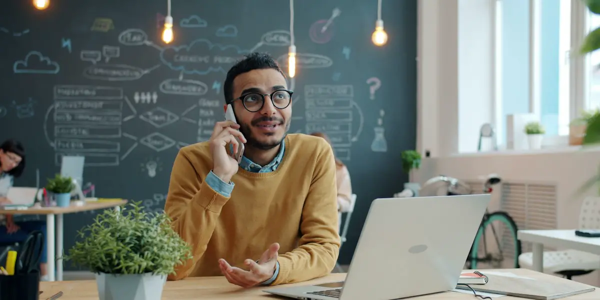 A salesperson on a call with a client.